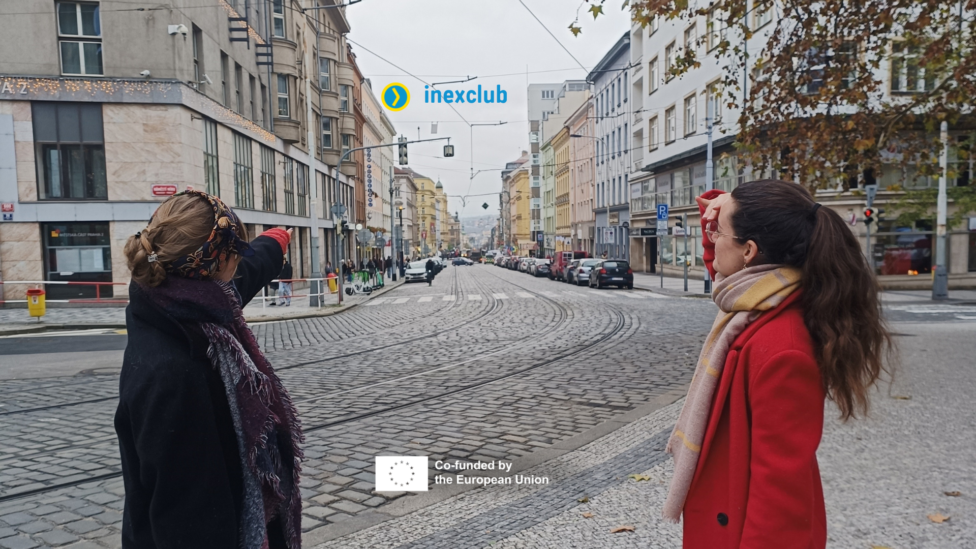 The facilitator of the event and a volunteer looking at the stree (methaphorically the future)