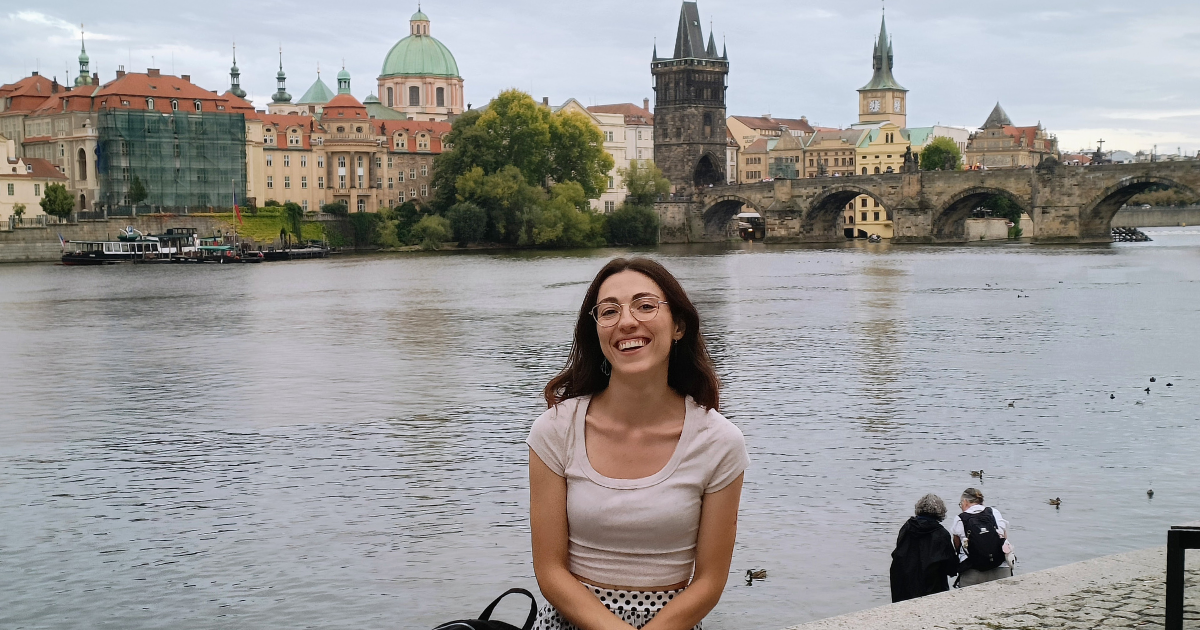 ESC volunteer Maria Quintana in Prague with Charles bridge in the background