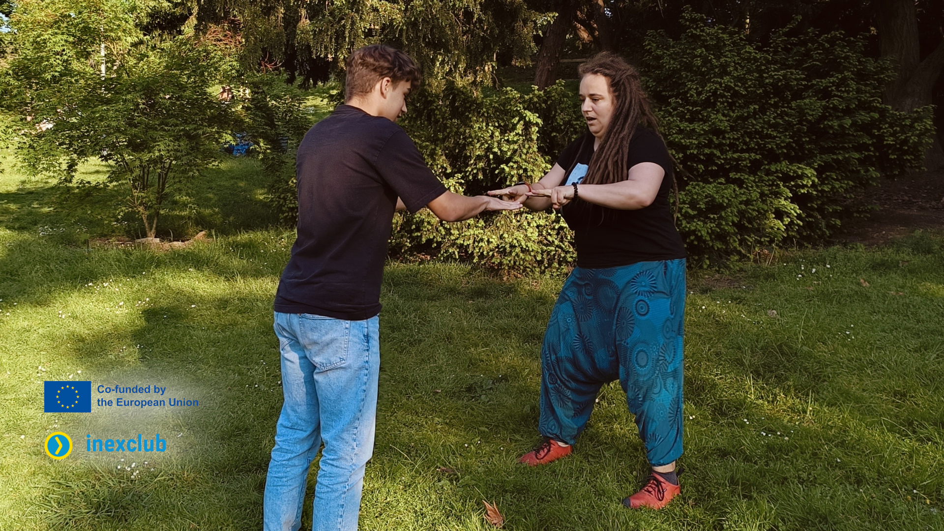 A trainer and a participant in an informal event.